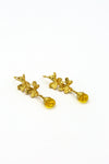 Fair Anita Golden Clover Field Earrings styled as a gift — ethically handcrafted drop earrings in gold-plated recycled brass