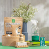 Green Llama dishwasher tabs, cleaning spray bottle, and other eco-friendly products on a green surface with a neutral background.