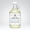 Half gallon glass jug of Rustic Strength Organic White Cleaning Vinegar 50 Grain