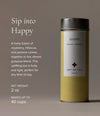 Art of Tea Happy Tea tin canister with label showing the raspberry hibiscus guayusa blend