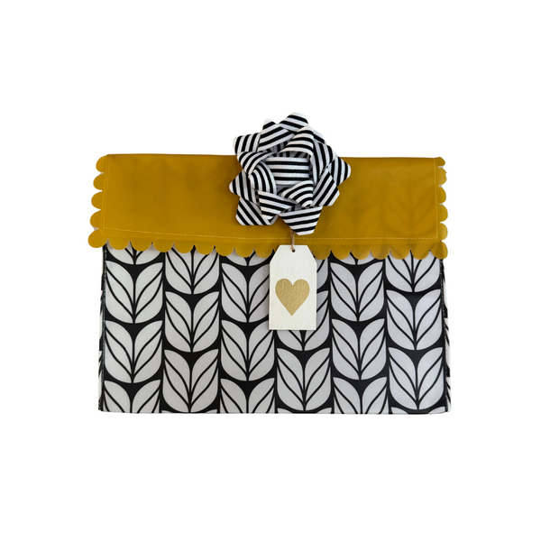 EverWrap wooden gold heart tag attached to an EverEnvelope reusable gift bag