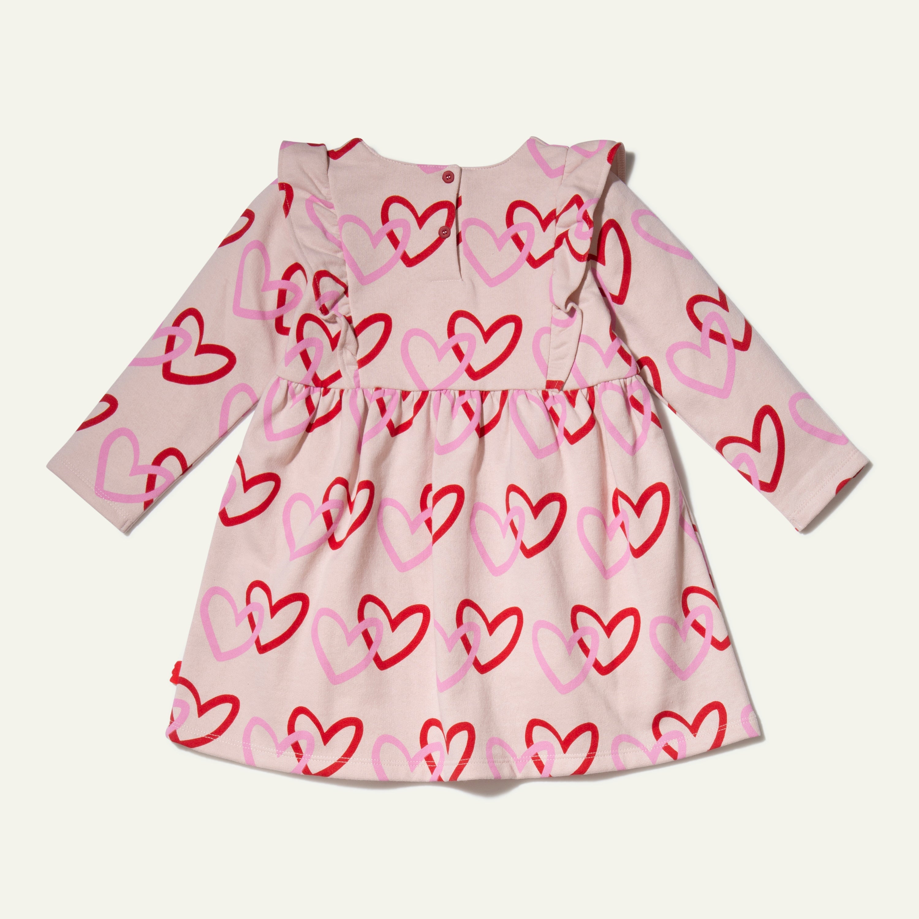 Mon Coeur Kids Recycled Cotton Heart Ruffle Dress — back view showing snap button closure
