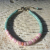 Heishi bone bracelet laid flat showcasing natural bone bead variations and Fair Trade craftsmanship from India