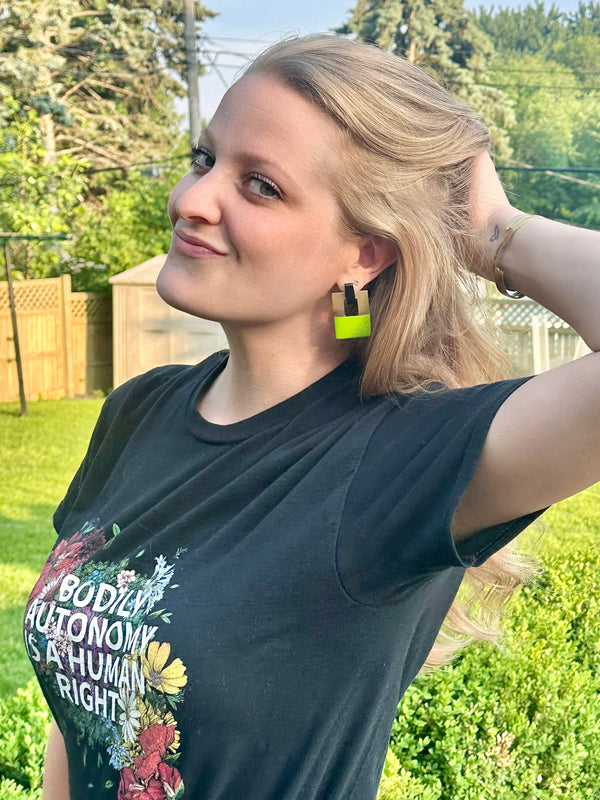 Green lacquered Hinged Horn Earrings handcrafted by women artisans in Vietnam