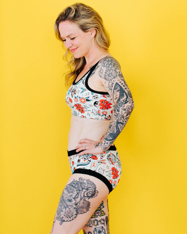 Close-up detail of the Inked Up tattoo illustration print on Thunderpants women's hipster underwear