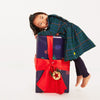 Baby wearing Mon Coeur recycled cotton leggings with a coordinating top, holiday styling