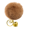 Brown fluffy keychain with gold heart-shaped charm on a white background