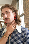 Close-up of red Hot Hippie Clay Earrings by Fair Anita – nickel-free, 2-inch drop
