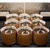 Brown grow bags with soil and green bottles on a metal rack against a beige tarp.