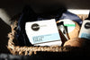 Heliotrope SF rosewater eye cream and natural skincare products arranged in a woven basket