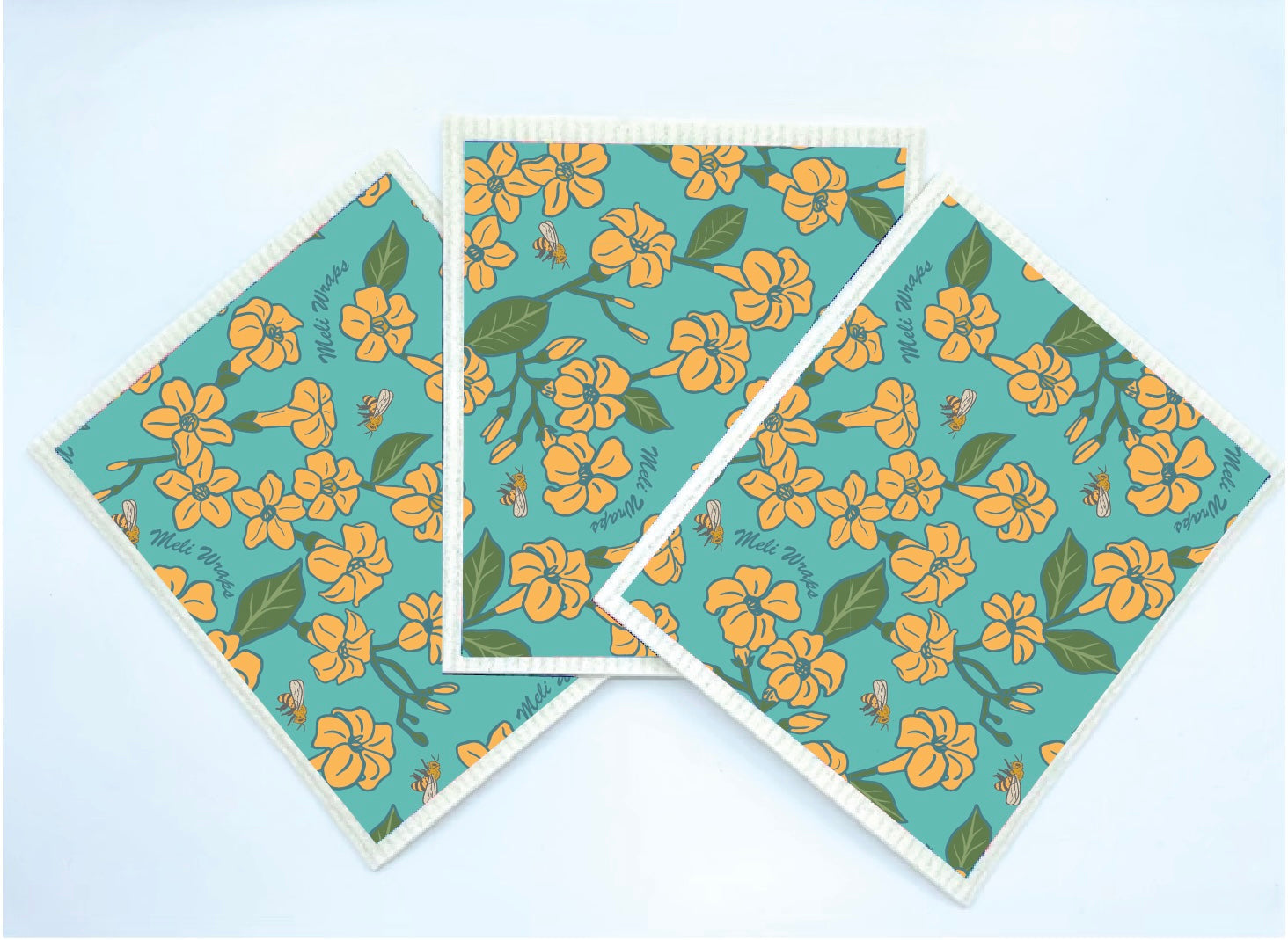 Cotton kitchen towels and Swedish dishcloths included in the Puakenikeni & Bee Gift Set