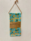 Puakenikeni & Bee Kitchen Towel Set of 2, 100% cotton, folded on a kitchen surface