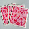 Pink Mushroom Swedish Dish Cloth being used to wipe a smooth surface