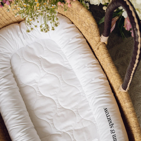 Close-up of the Plum+Sparrow Nest Lounger showing washable cotton fabric and polyfill cushioning