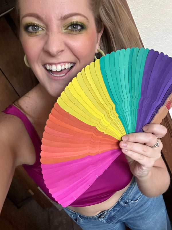 Close-up of Fair Anita pride palm fan showing natural dyed palm leaf texture and eco-friendly materials