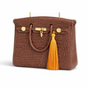 The Brown Iconic luxury scented candle by Onali Pure in a rich earthy brown vessel on a styled surface