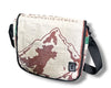 Messenger bag with mountain design and 'Composite Cement' branding on a white background