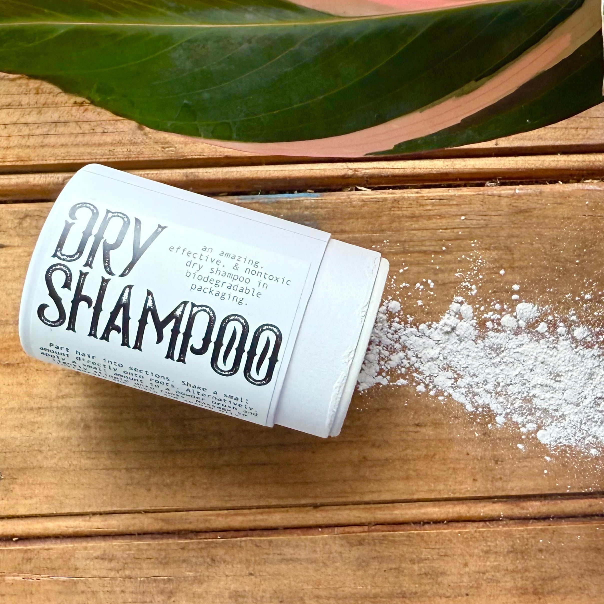 Apotheke DuJardin natural dry shampoo powder with kaolin clay and rosemary essential oil in a small jar