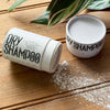 Close-up of Apotheke DuJardin scalp-supporting dry shampoo powder showing organic ingredients and texture