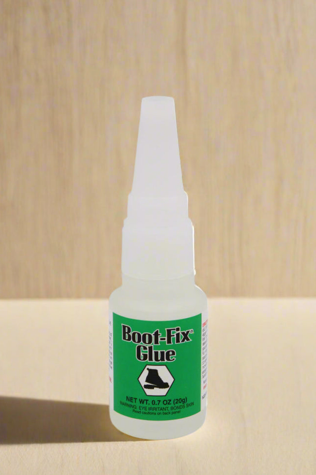 Boot-Fix Shoe Glue being used to repair a separated boot sole
