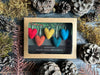 Small wool heart ornaments, about 1 inch across, for mini holiday trees