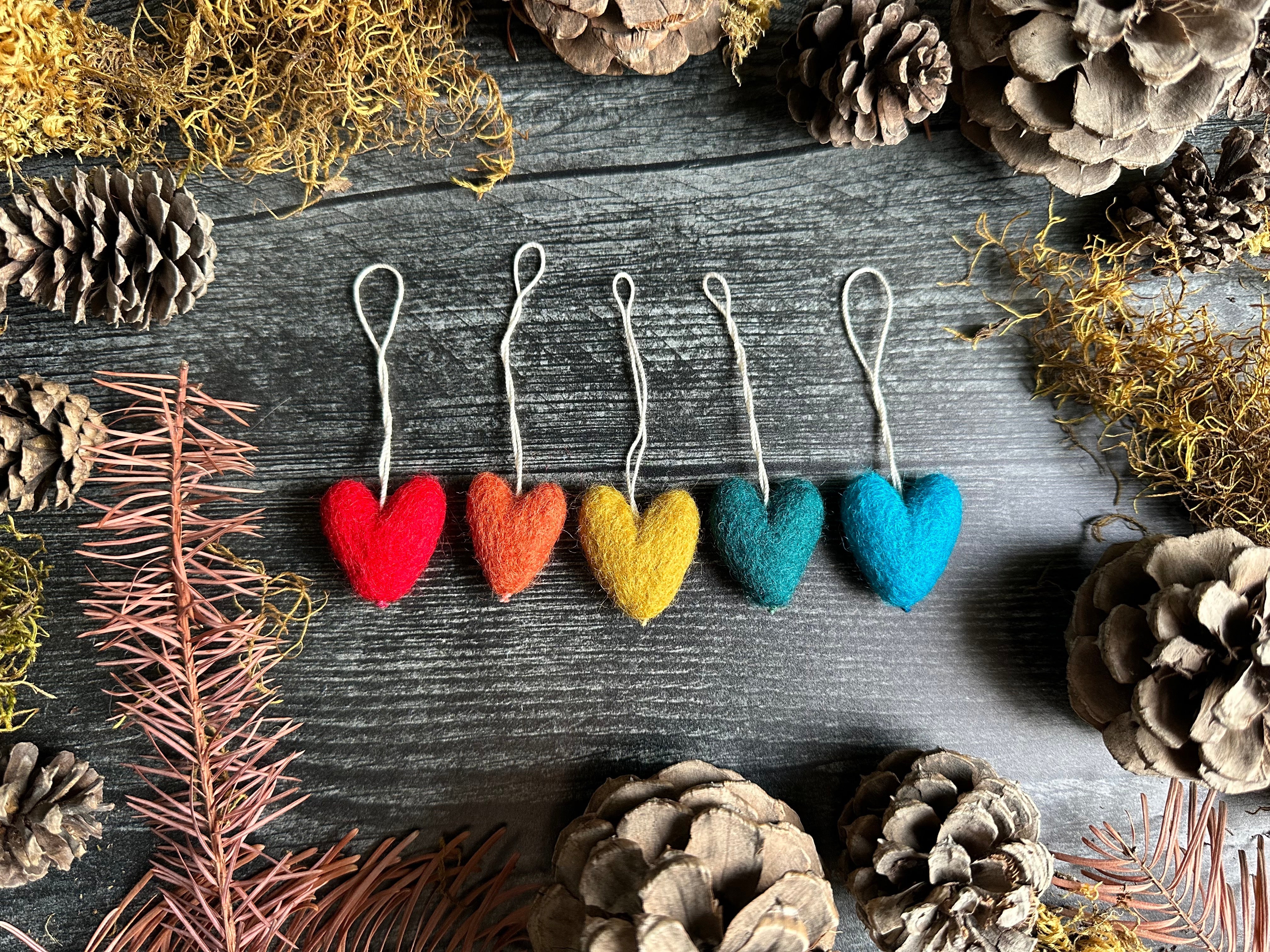 Set of five rainbow wool heart ornaments by House of Moss