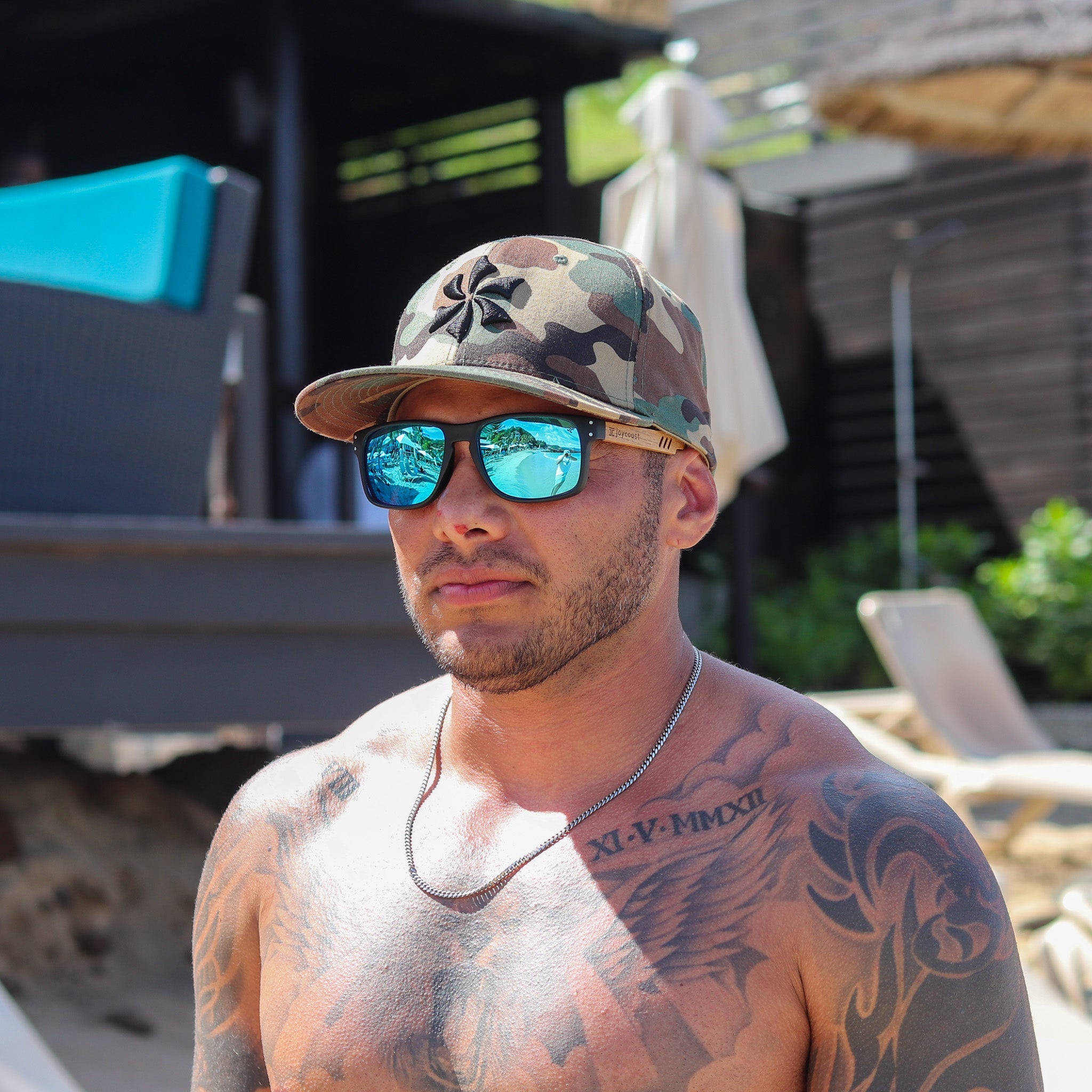 Person wearing Joycoast Vents sporty wooden sunglasses outdoors with polarized lenses