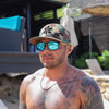 Person wearing Joycoast Vents sporty wooden sunglasses outdoors with polarized lenses