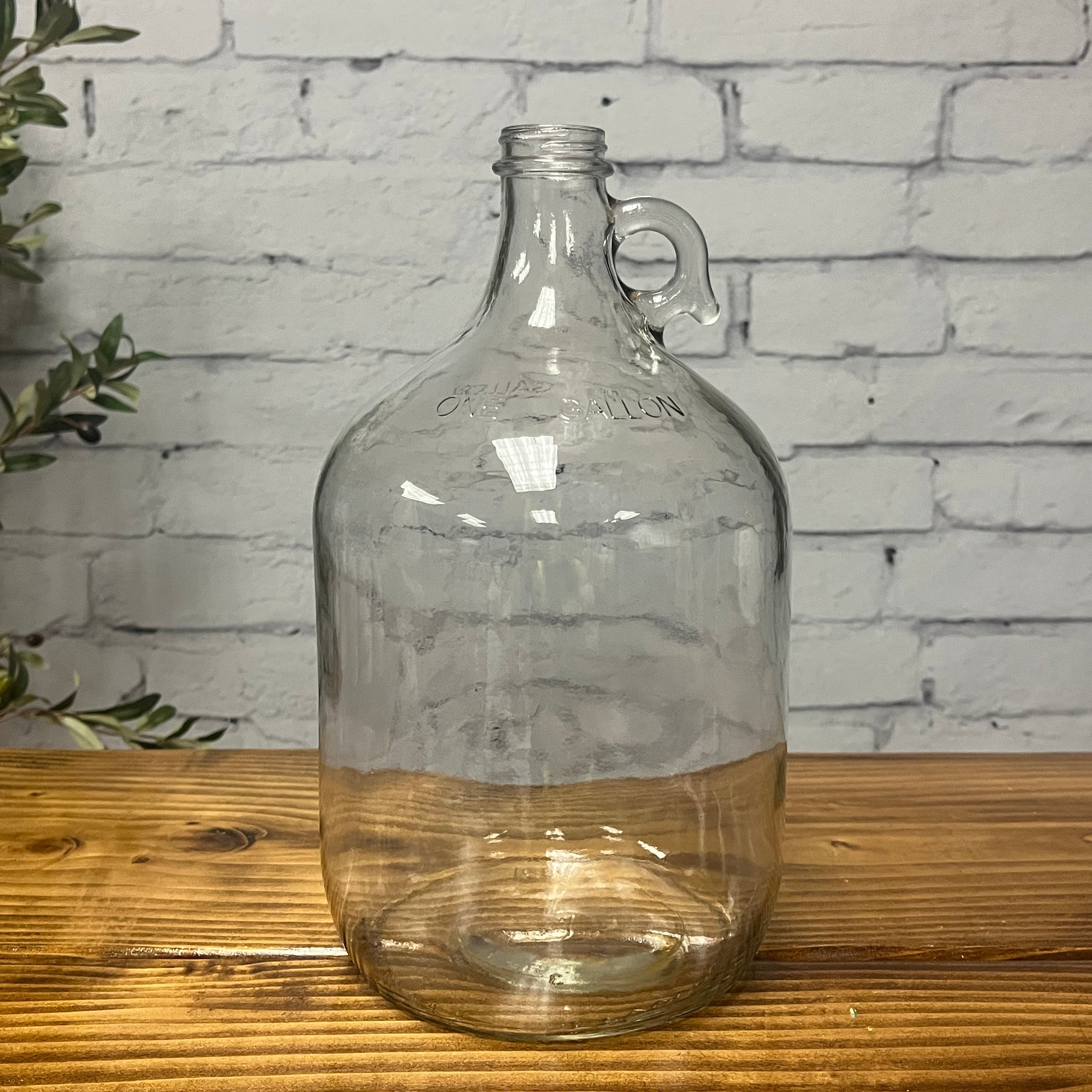 Close-up of 1 gallon glass jug cap and neck from Rustic Strength