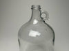 Rustic Strength 1 gallon glass jug showing full body and secure screw-top cap