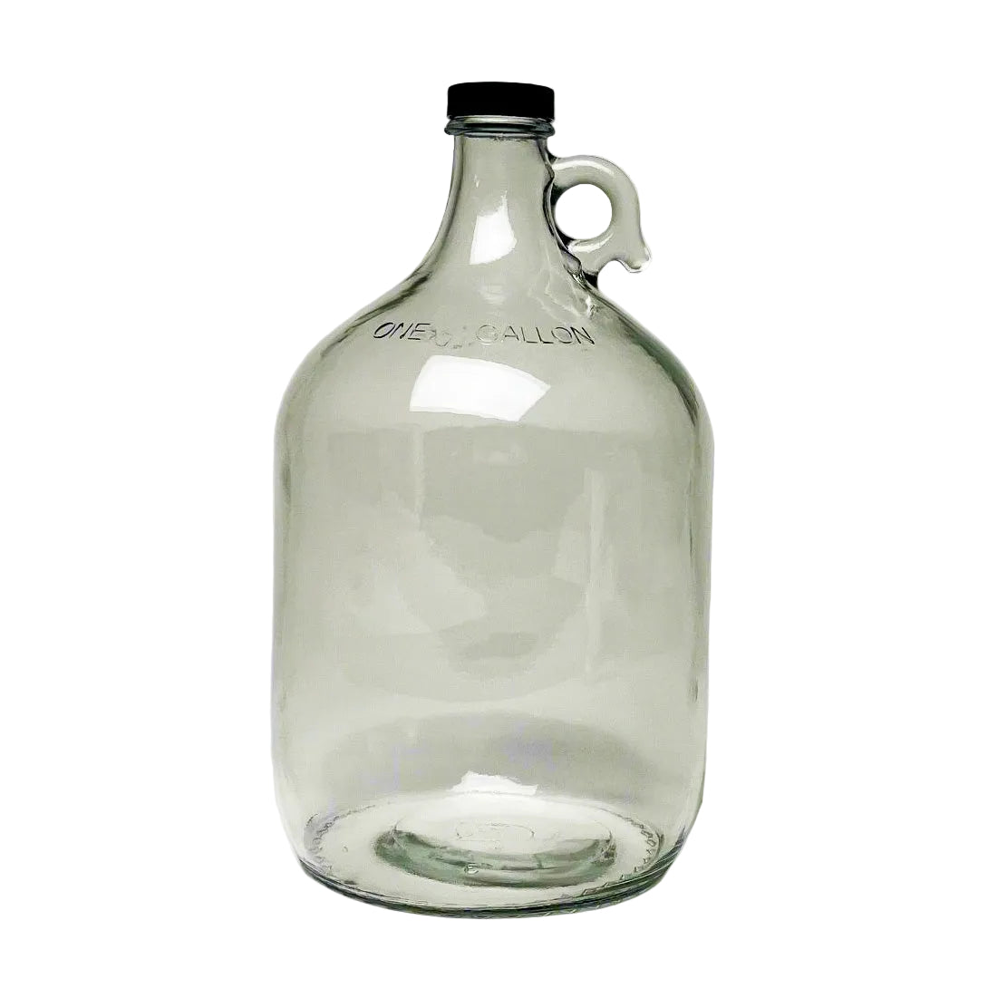 Rustic Strength 1 gallon glass jug with screw cap on a wooden surface