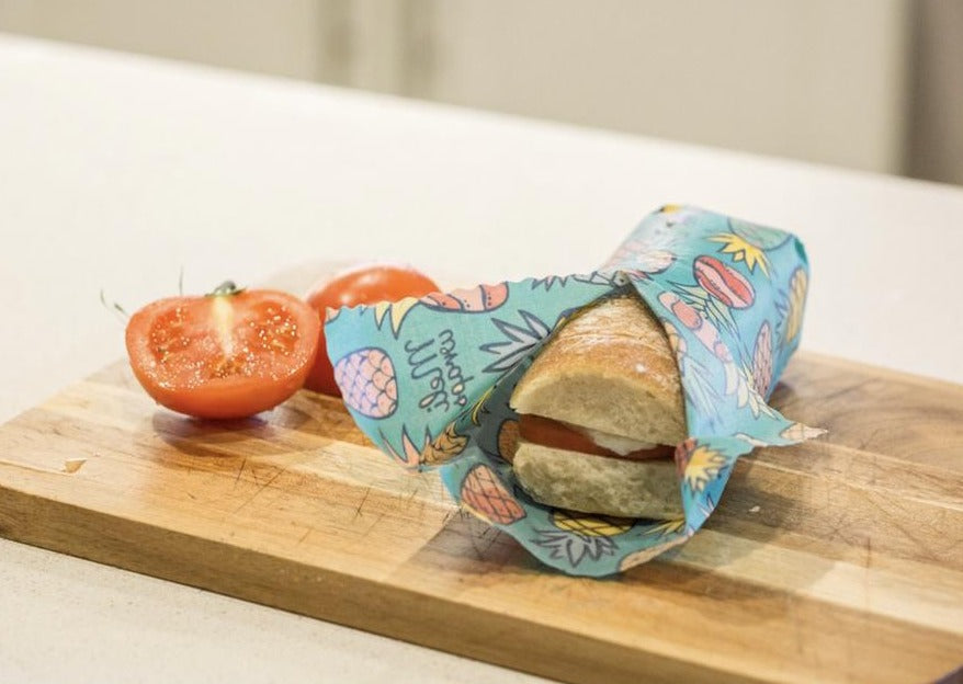 Meli Wraps Pineapple Print beeswax food wrap in use in the kitchen