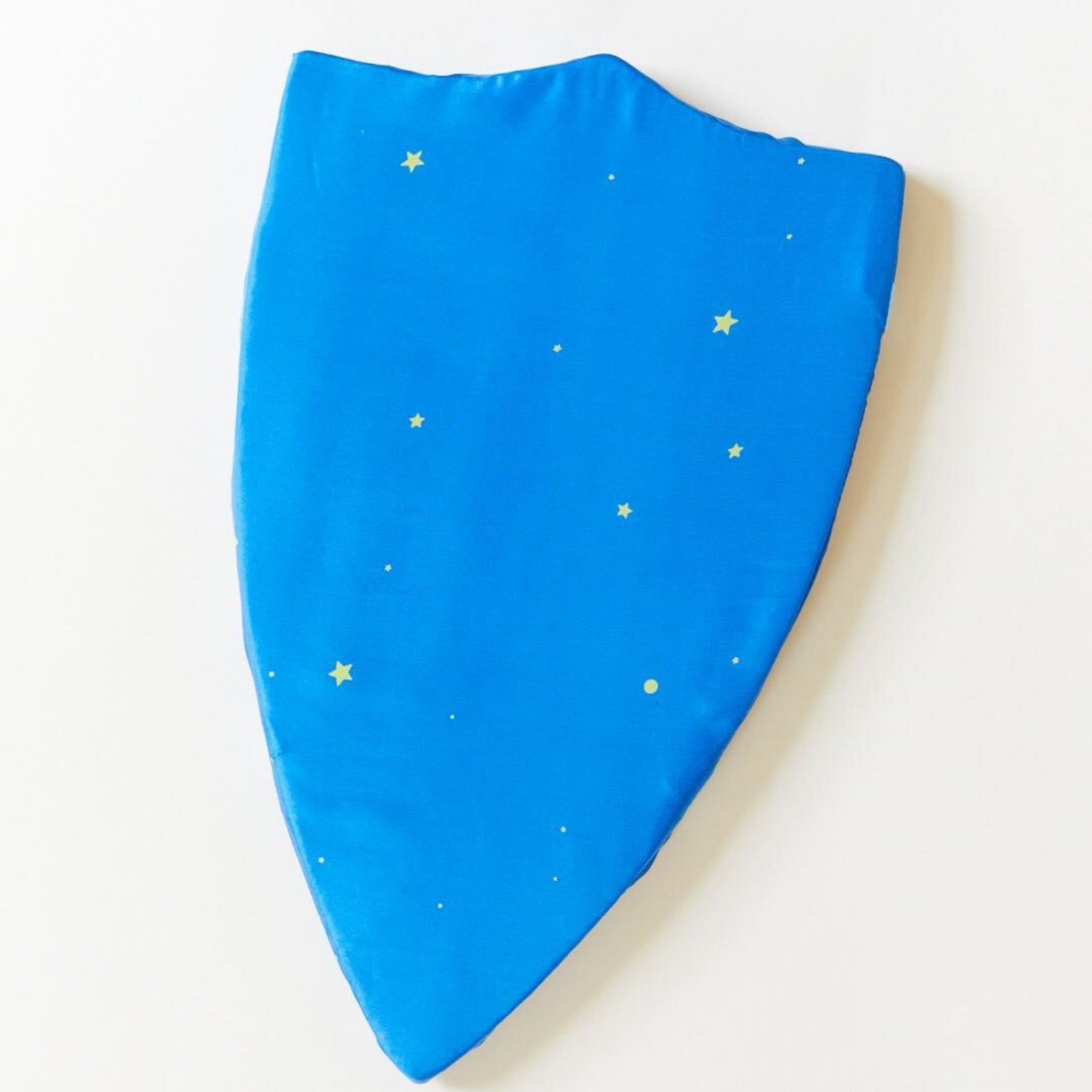 Blue fabric with yellow star patterns on a white background. Spark imaginative play with Sarah's Silks Star Shield. This silk play shield is perfect for active play, developing motor skills and encouraging creativity. Made with pure silk and soft foam for endless adventures.