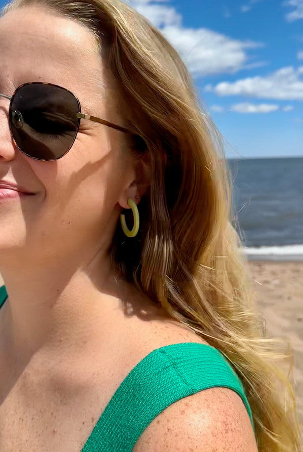 Close-up of nickel-free upcycled bone hoop earrings measuring 1.5 inches — lightweight and fair trade