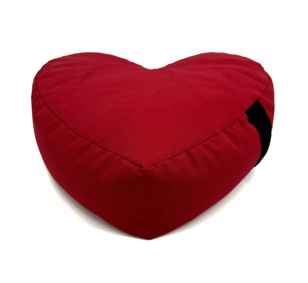 Red heart-shaped zafu meditation cushion made from cotton with buckwheat hull filling
