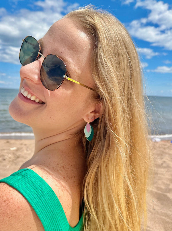 Model wearing Leaf Tones earrings showing length and fit