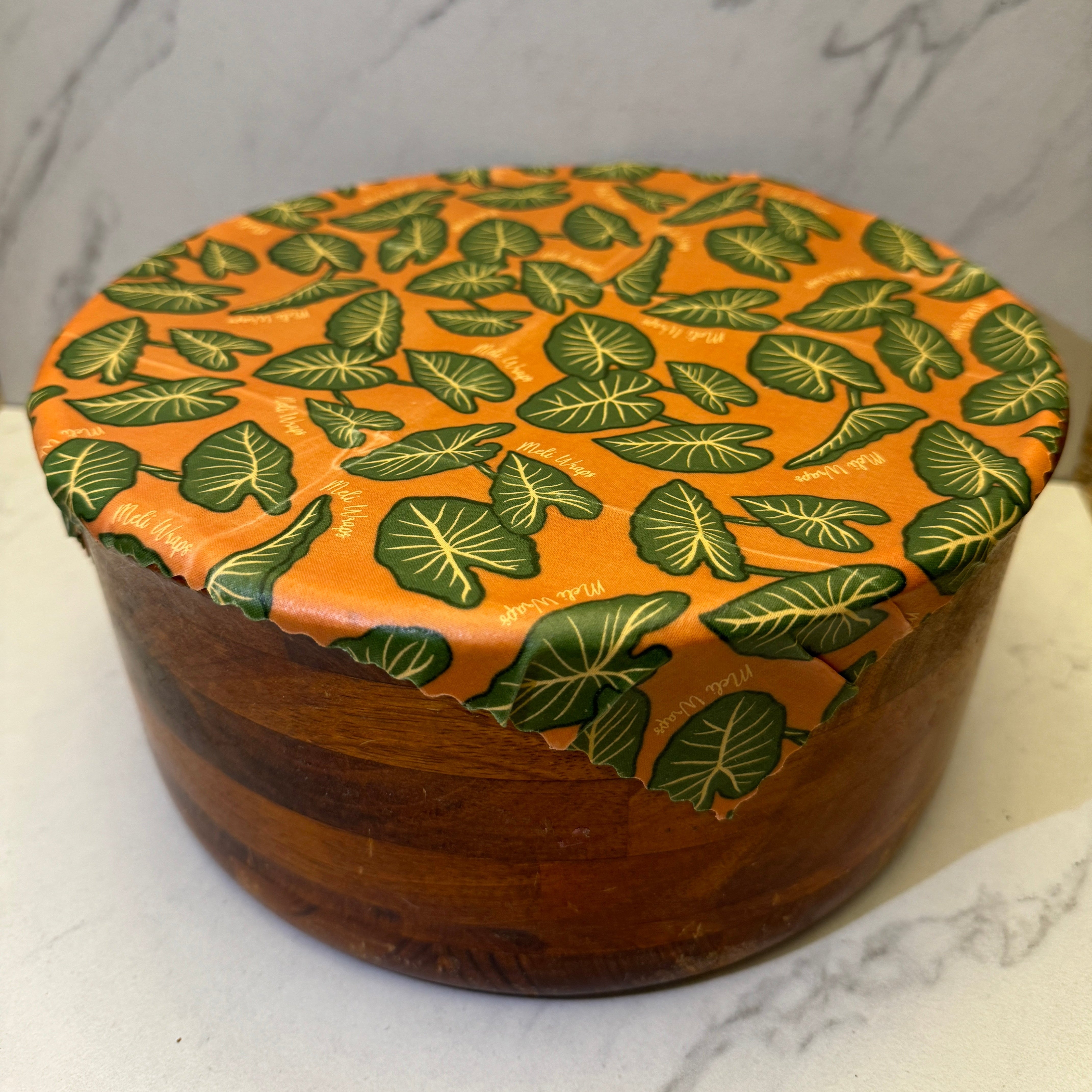Meli Wraps Beeswax Food Wrap in Kalo Print wrapped around food