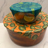 Fern print beeswax wrap cut and folded around food for storage
