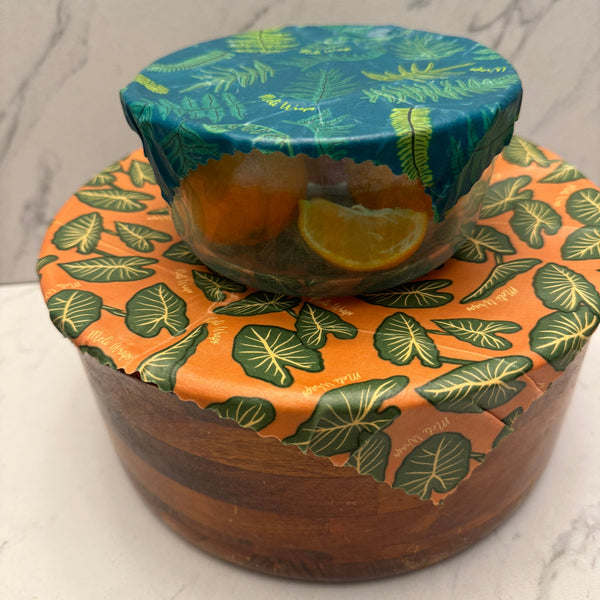 Fern print beeswax wrap cut and folded around food for storage