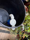 Auto fill float valve installed in a gravity-fed water reservoir
