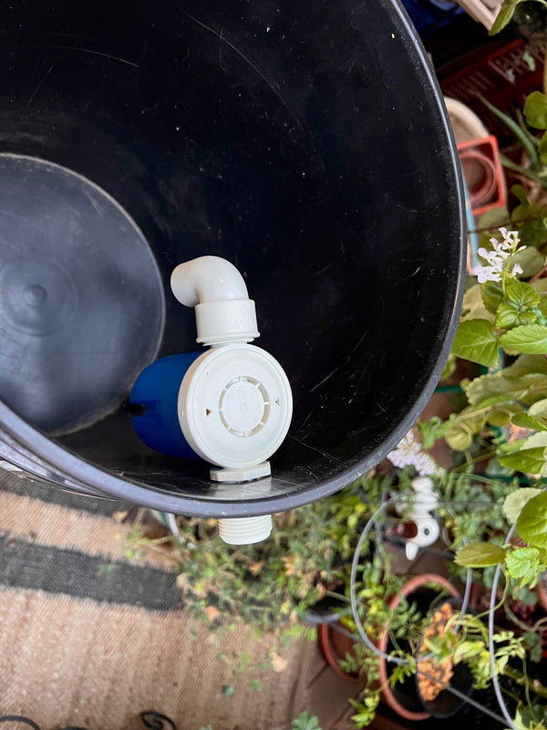 Auto fill float valve installed in a gravity-fed water reservoir
