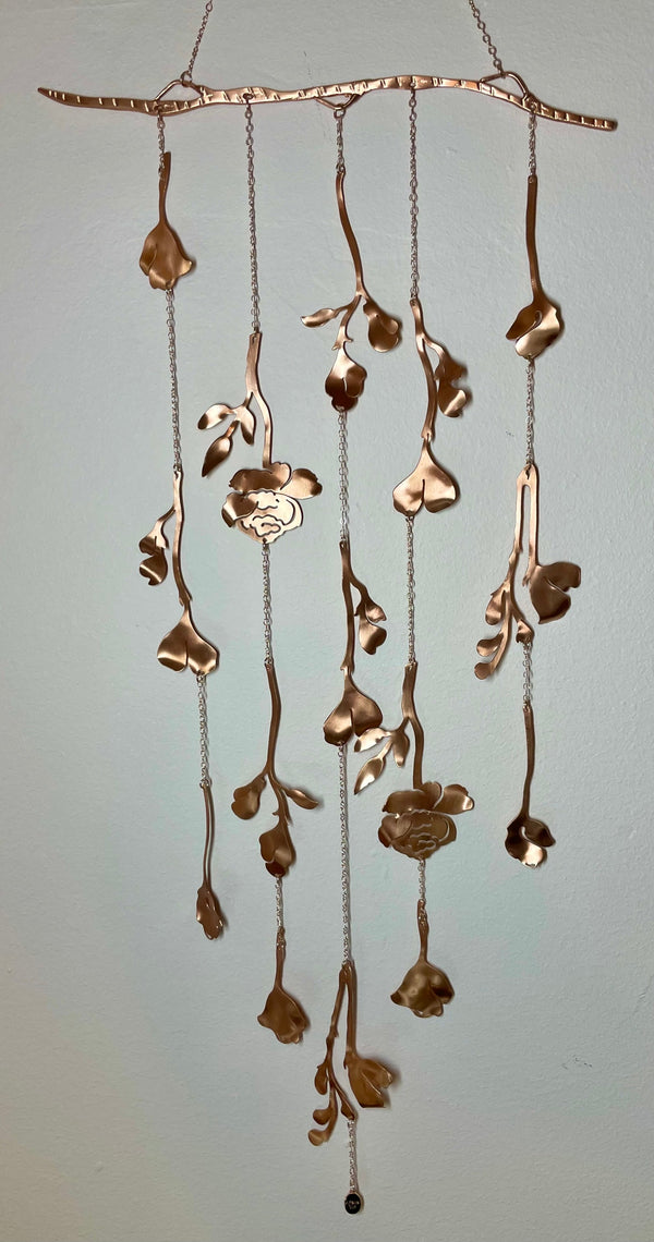 Ariana Ost's Cascading Floral Wall Hanging - handcrafted brass masterpiece, nature-inspired beauty for home/garden. Made in USA! Shop now & support artisans.