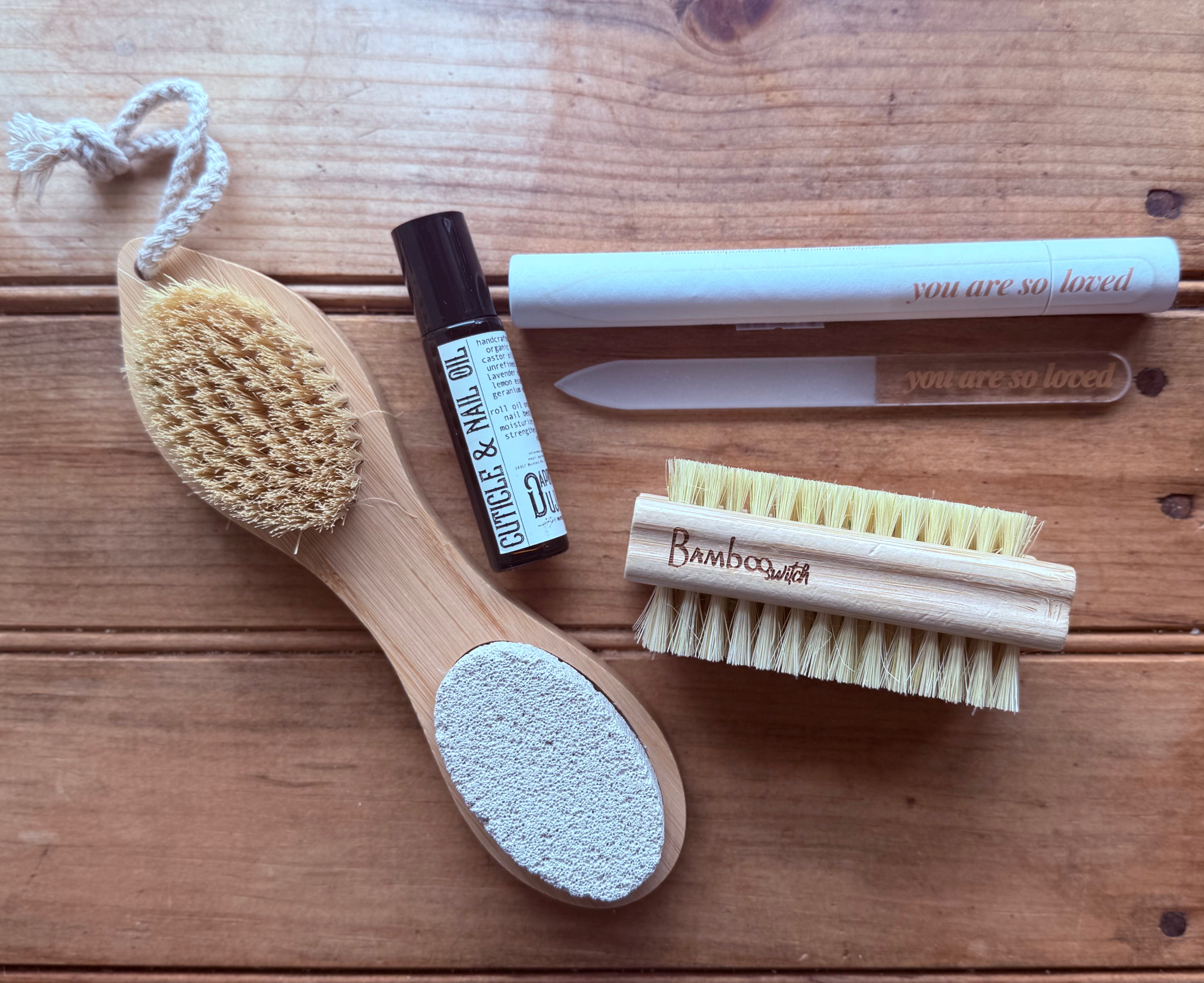 Close-up of Apotheke DuJardin cuticle and nail oil roller bottle showing label detail with natural ingredient callouts