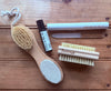 Close-up of Apotheke DuJardin cuticle and nail oil roller bottle showing label detail with natural ingredient callouts