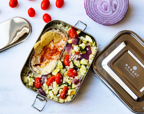 Ecozoi plastic-free stainless steel lunch box filled with a fresh meal, top-down view