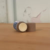 Close-up of grass-fed beef tallow lip balm handcrafted with organic beeswax and essential oils by Apotheke DuJardin