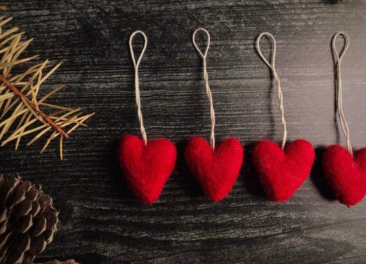 Needle-felted wool heart ornament in Amanita Red with cotton string hanger