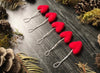 Amanita Red wool heart ornaments, set of 5, shown together as a holiday decoration set