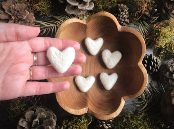 Close view of felted wool hearts in Snowberry White