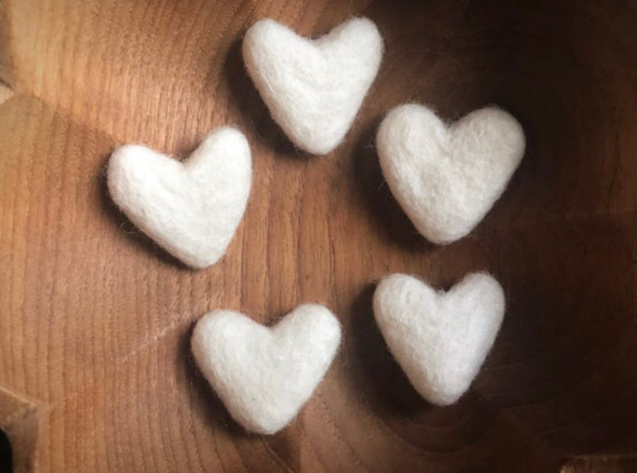 Snowberry White felted wool hearts showing their organic, non-uniform shapes